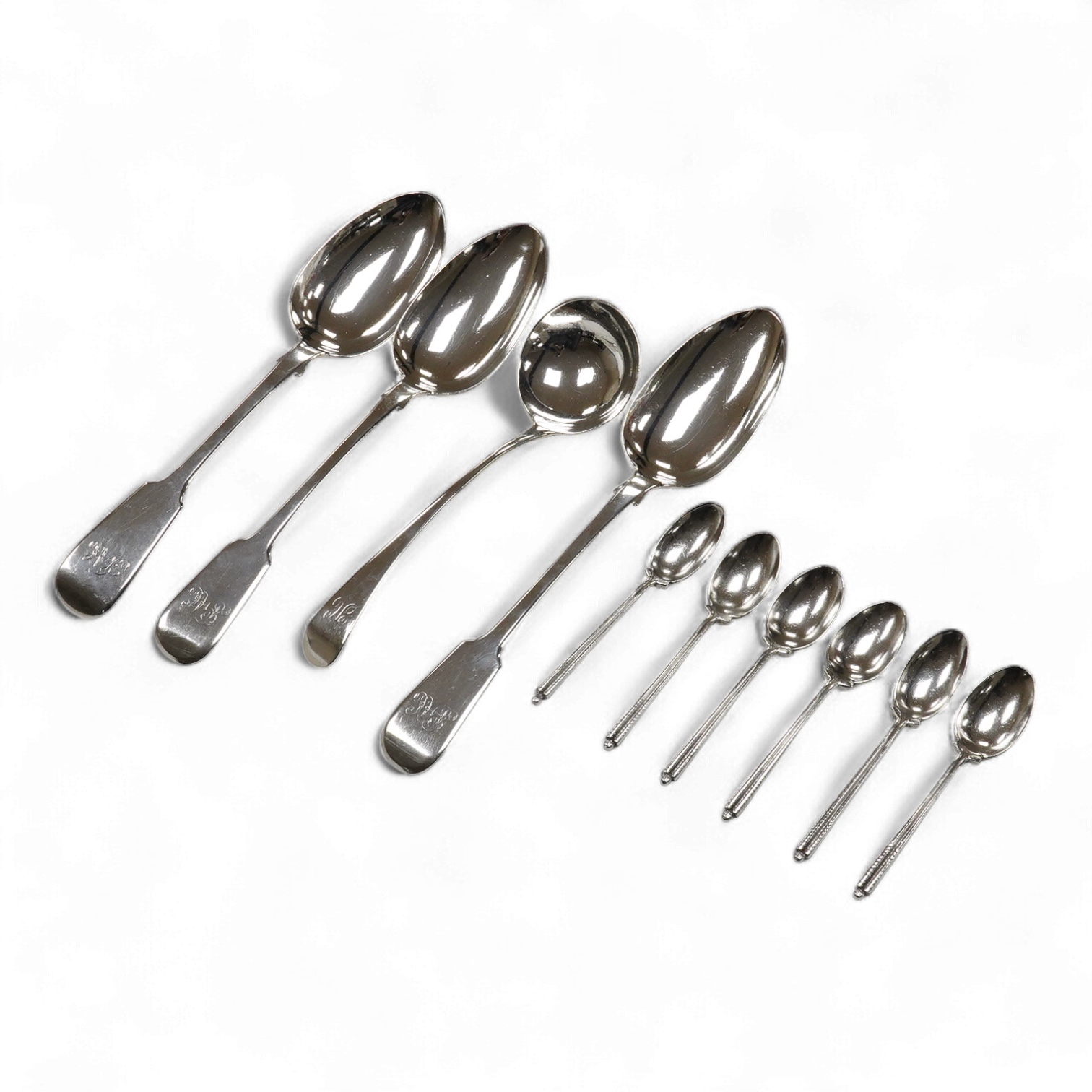 A matched set of three 19th century silver fiddle pattern tablespoons, Josiah Piercy I, London, 1828(2) and The Lias Brothers, London 1831, together with a George III silver Old English pattern sauce ladle Peter & Willia